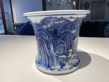 A fine Chinese blue, white and copper red 'Master of the Rocks' brush pot, Kangxi